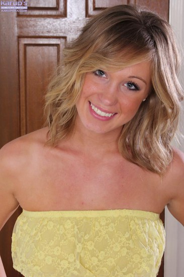 Amazing blonde chick Ashley Jones gets out of her jeans shorts and her yellow top and masturbates