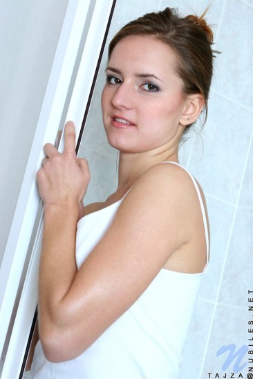 Tajza Nubiles gets wet and peels off her white clothes in the shower cabin