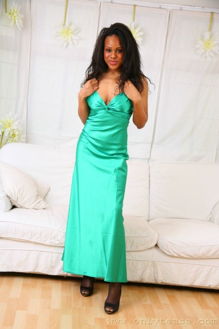 Frisky black honey Olivia B does some posing in long green evening dress and without it