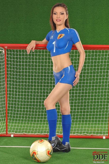 Oriental body art model Annie Ling pretends that she wears blue skin tight soccer uniform